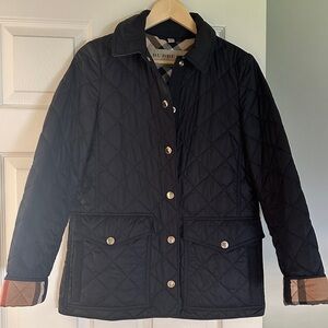 Burberry women’s black quilted button jacket